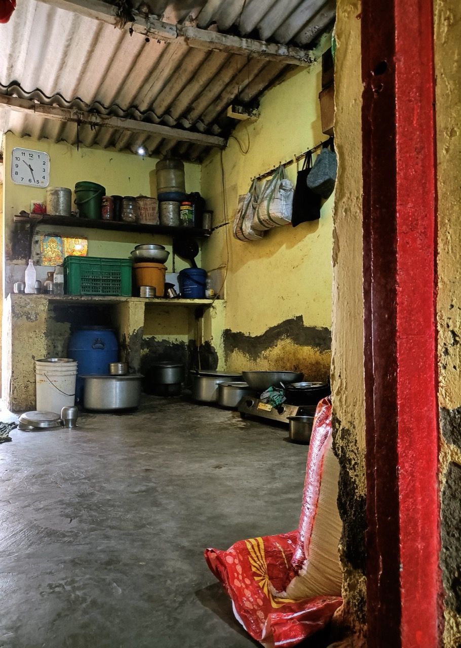 The asbestos-roofed house.